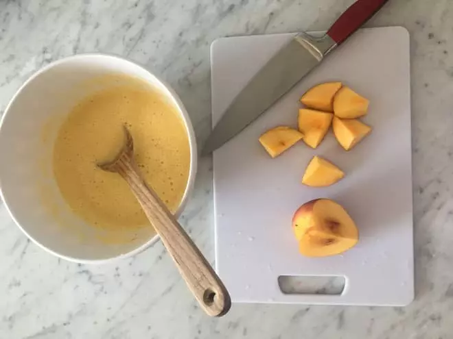 Now take your remaining peaches and cut them into small pieces. These can be added to your trays to add some colour to your popsicles.